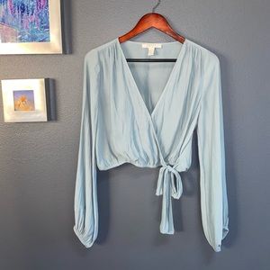 Semi-sheer, loose-fitting, deep neck, crop